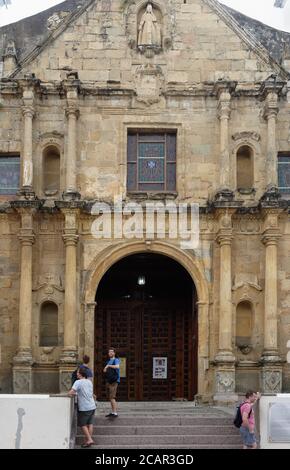 Tourists by the wooden doors at the entrance to the Metropolitan Cathedral  in the Old Town of Panama City, Panama, Central America Stock Photo