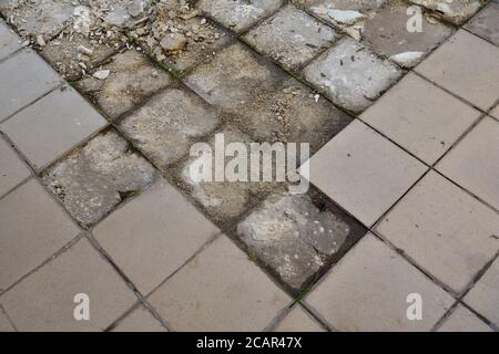 Chipping off old tiles on the terrace during renovation, replacing them with new ones. Terrace. Stock Photo