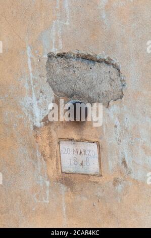 Italy, Lombardy, Milan, Corso di Porta Romana Street, Five Days of Milan, Cannon Ball Embedded in the Wall