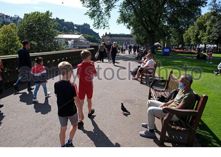 Edinburgh, Scotland, UK. 8th Aug 2020. Warm Sunny weather brings out visitors to East Princes Street Gardens.  Credit: Craig Brown/Alamy Live News Stock Photo