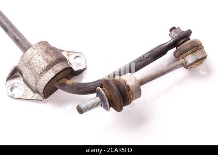 Close-up metal stabilizer rack on a white background in a second-hand photo studio with rust for replacement during repair or for sale at an auto-pars Stock Photo