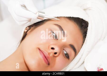 The concept of health, beauty, spa and leisure - beautiful woman and spa receiving massage Stock Photo
