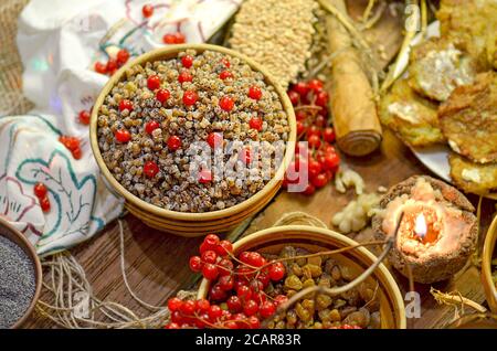 Ingredients for traditional kutia. Christmas dessert with walnuts and poppy seed in ceramic bowl Stock Photo