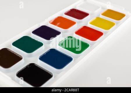 jars of colored paint for creativity on a white background Stock Photo
