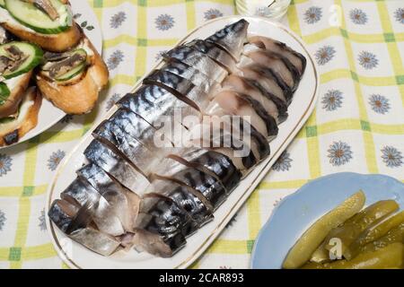 smoked fish sliced on a plate for a festive dinner Stock Photo