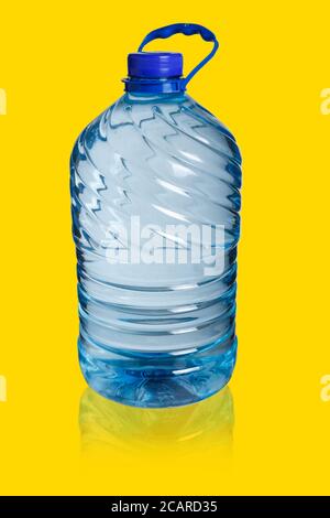 Big bottle of water on a gold background. Five liters Stock Photo