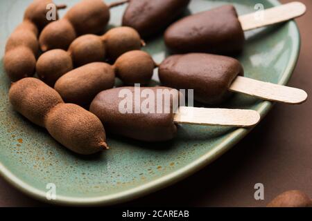 Imli stick Candy or Tamarind Lollipop is kids favourite sweet food in India Stock Photo