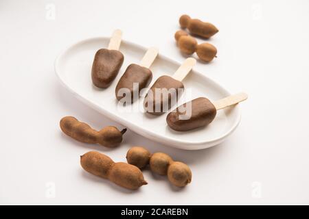 Imli stick Candy or Tamarind Lollipop is kids favourite sweet food in India Stock Photo