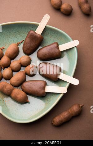 Imli stick Candy or Tamarind Lollipop is kids favourite sweet food in India Stock Photo