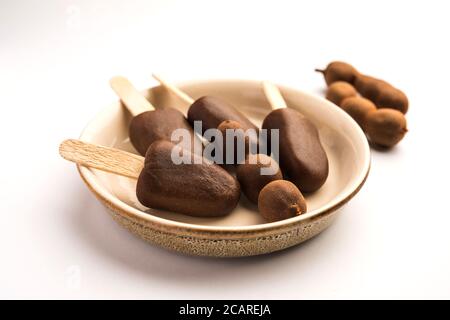 Imli stick Candy or Tamarind Lollipop is kids favourite sweet food in India Stock Photo