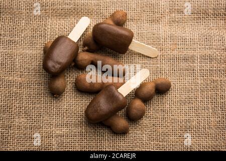 Imli stick Candy or Tamarind Lollipop is kids favourite sweet food in India Stock Photo