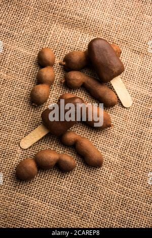 Imli stick Candy or Tamarind Lollipop is kids favourite sweet food in India Stock Photo