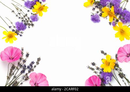 Flowers composition. Yellow and purple flowers on white background. Spring, easter concept. Flat lay, top view, copy space Stock Photo