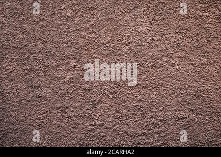 Pale subdued flat tone bronze textured background. Stock Photo