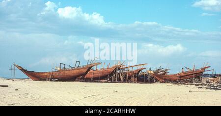 Ajman, United Arab Emirates.  Dhows Under Construction on the Beach. Photographed February 1985. Stock Photo