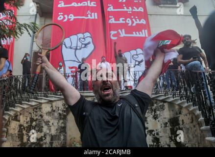 Beirut, Lebanon. 08th Aug, 2020. An anti-government demonstrator shouts slogans inside the premises of the Lebanese Foreign Ministry, after protesters stormed it during a protest in the aftermath of Tuesday's explosion. Credit: Marwan Naamani/dpa/Alamy Live News Stock Photo