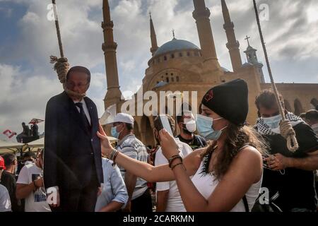 Beirut, Lebanon. 08th Aug, 2020. An anti-government demonstrator takes a picture of Lebanese President Michel Aoun during a symbolic trial in the aftermath of Tuesday's explosion. Credit: Marwan Naamani/dpa/Alamy Live News Stock Photo