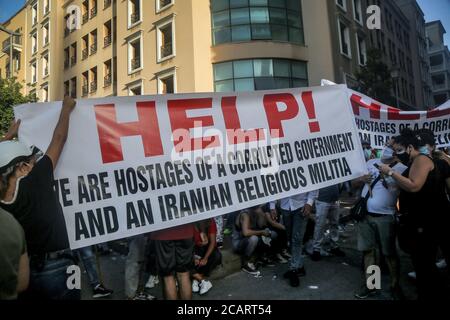 Beirut, Lebanon. 08th Aug, 2020. Anti-government demonstrators hold a banner during a protest against the Lebanese government, in the aftermath of Tuesday's port explosion that rocked the capital. Credit: Marwan Naamani/dpa/Alamy Live News Stock Photo