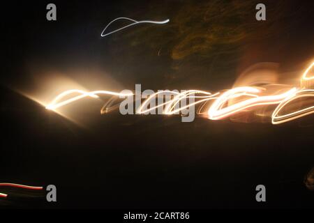 Abstract yellow blur on black. Lights motion effects creative background Stock Photo