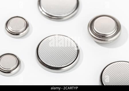 Group of button cell battery or coin cell isolated on white background. Lithium batteries Stock Photo