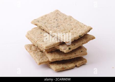 Dry thin lemon leaves crackers. Tasty crispy crackers isolated on white background Stock Photo