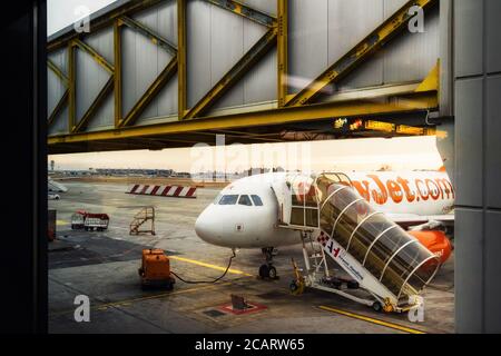 Milan Italy - January 30, 2019: Easy Jet company airplane and boarding stairs, preparations before flight in Malpensa Airport (Milan, Italy) on januar Stock Photo