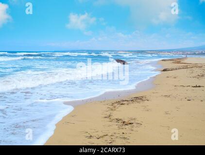 golden shore under a cloudy sky in Sardinia, Italy Stock Photo