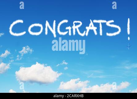 congrats! written in the sky with contrails Stock Photo