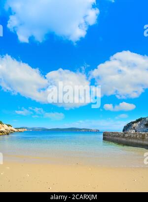 golden shore under a cloudy sky in Sardinia, Italy Stock Photo