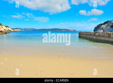 golden shore under a cloudy sky in Sardinia, Italy Stock Photo