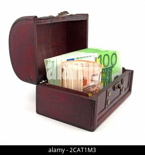Lots of euro bank notes in a wooden chest Stock Photo