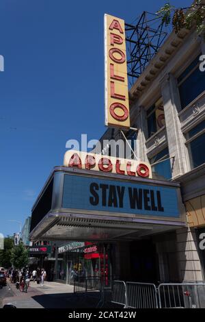 the closed Apollo Theater or Theatre in Harlem flashes a STAY WELL sign to the public during the coronavirus or covid-19 pandemic Stock Photo