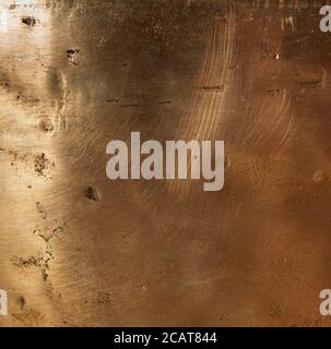 texture of yellow old copper plate with scratches and scuffs, full frame, macro Stock Photo