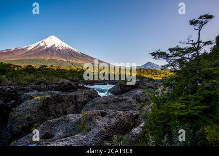 Osorno Volcano seen over Petrohue Waterfalls in Chile Stock Photo