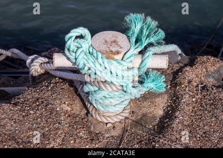 Ropes tied around anchor point Stock Photo