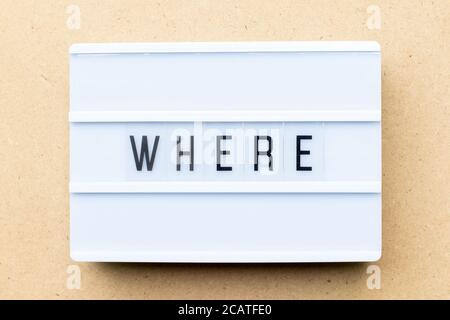 White lightbox with word where on wood background Stock Photo