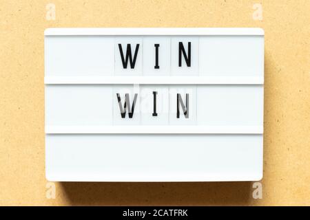 Lightbox with word win win on wood background Stock Photo