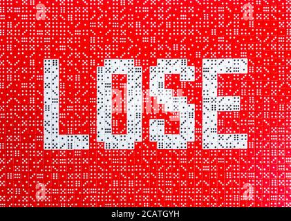 The word LOSE spelled in a field of dice Stock Photo