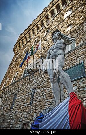 Michelangelo's David with French flag in Piazza della Signoria, Florence Stock Photo