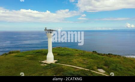 Lighthouse on a tropical island, view from above. Beautiful landscape with a green island. Summer and travel vacation concept. Basot Island, Caramoan, Camarines Sur, Philippines. Stock Photo