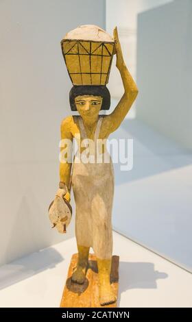 Exhibition 'The animal kingdom in Ancient Egypt', organized in 2015 by the Louvre Museum in Lens. Woman bringing offerings. Stock Photo