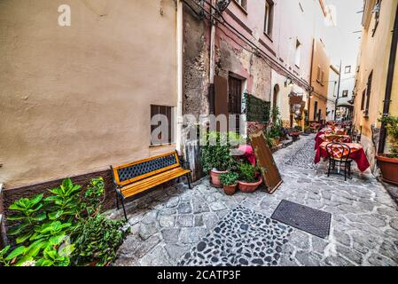 rustic tables in Castelsardo old town, Sardinia Stock Photo