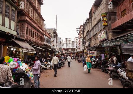 Agra / India - February 22, 2020: people walking down street of historical center of Agra Stock Photo