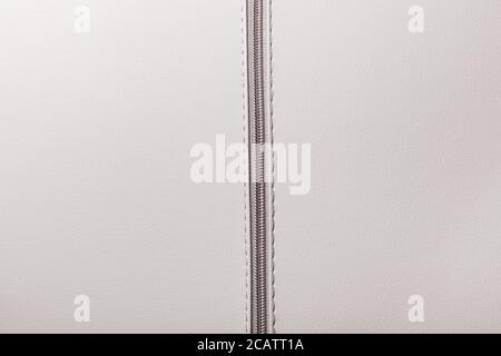 White ,  light beige faux leather with zipper Stock Photo