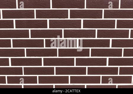 Brown smooth brick wall in a row. Stock Photo