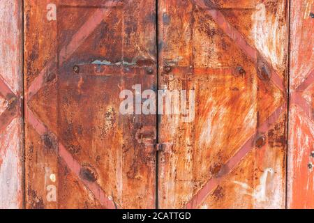 Red iron metallic grunge rusty background. Old garage door Stock Photo