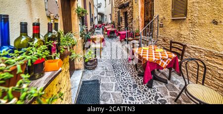 rustic tables in Castelsardo old town, Sardinia Stock Photo