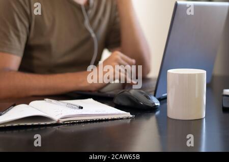 Closeup shot of male hands using a laptop Stock Photo