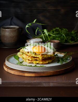 Levitation. Hearty fat breakfast. Dark brown table. Close up, vertical, copy space Stock Photo