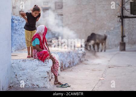 Jodhpur / India - March 18, 2020: Grandmother being mocked by granddaughter in the streets of Jodhpur Stock Photo